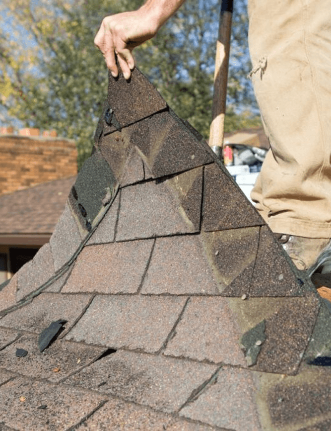 a person Replacing roof shingles