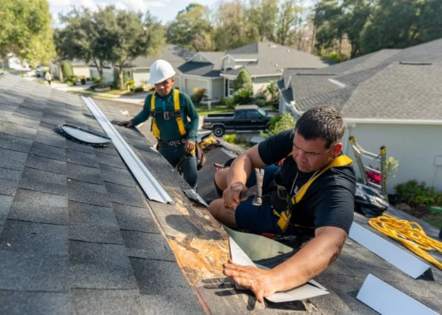 a group of men working on a roof