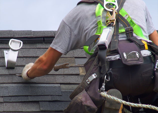 a man working on a roof