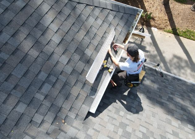 a man working on a roof