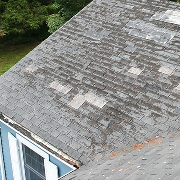 a roof of a house with a broken roof