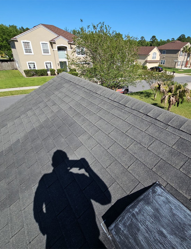 a person's shadow on a roof