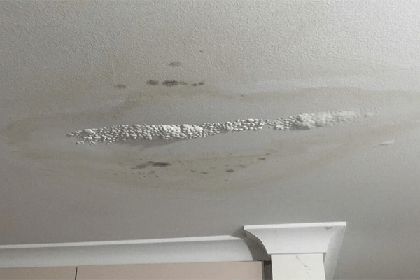 a ceiling with water stains